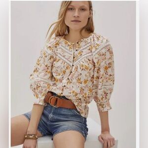 Anthropologie Harmony Lace Peasant Blouse in a white, pink, and yellow floral